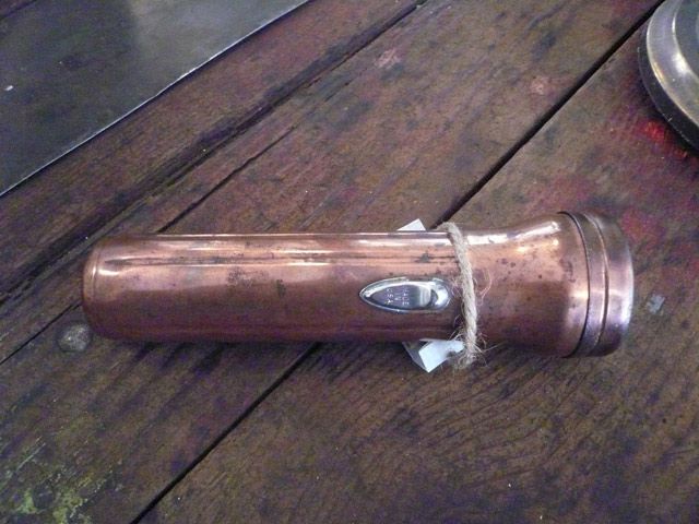 "This copper flashlight is also functional, in fact it works very well. I had a smaller nickel-plated one which was my very first sale (sold to a cute 4-year old kid at my opening reception, he created 'mood lighting' for us with it all evening!)."